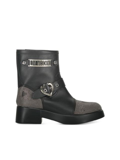Moschino buckle-detailed studded ankle boots