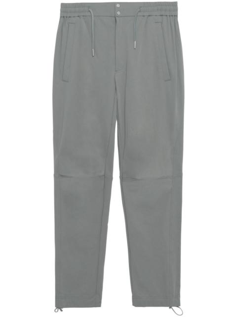 SIMKHAI Caruso tapered-leg trousers