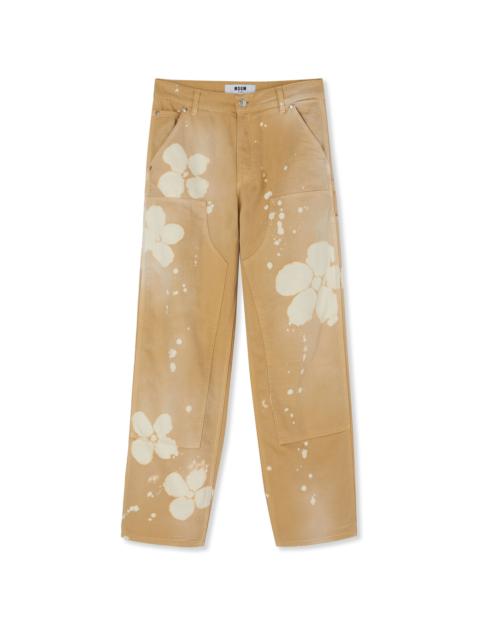 Workwear pants with tie-dye daisies