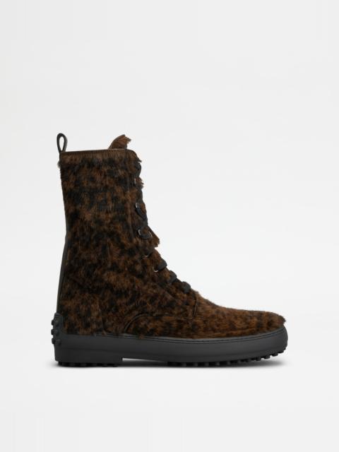 Tod's WINTER GOMMINO ANKLE BOOTS IN PONY EFFECT LEATHER - BLACK, BROWN