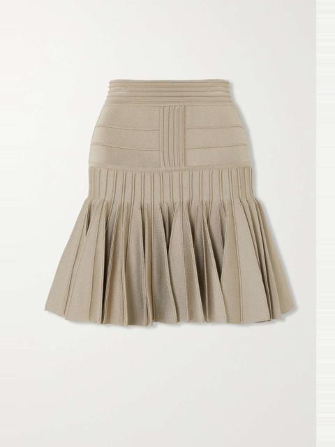 Pleated paneled knitted mini skirt