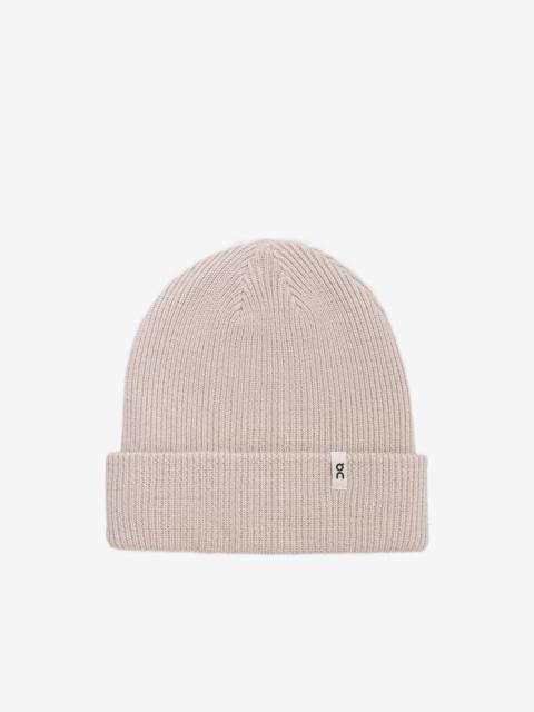 On ribbed-knit beanie hat