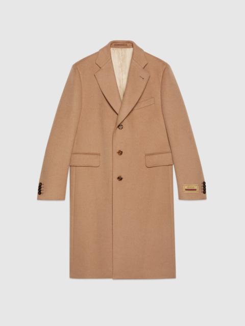 Camel coat with label