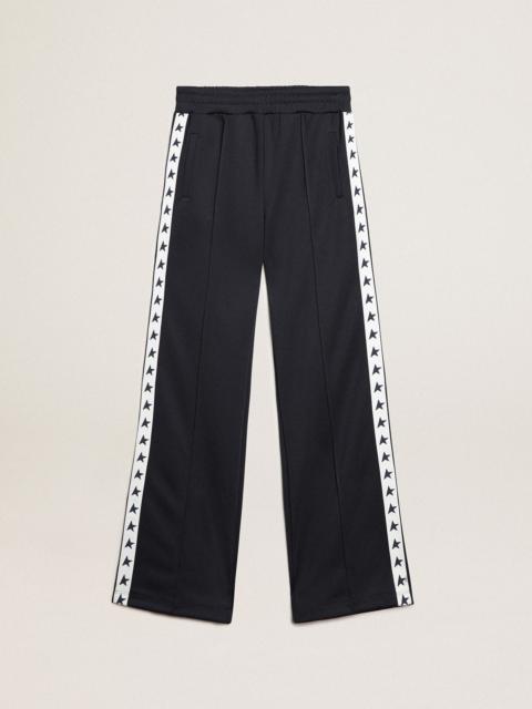 Women's black joggers with white stars on the sides