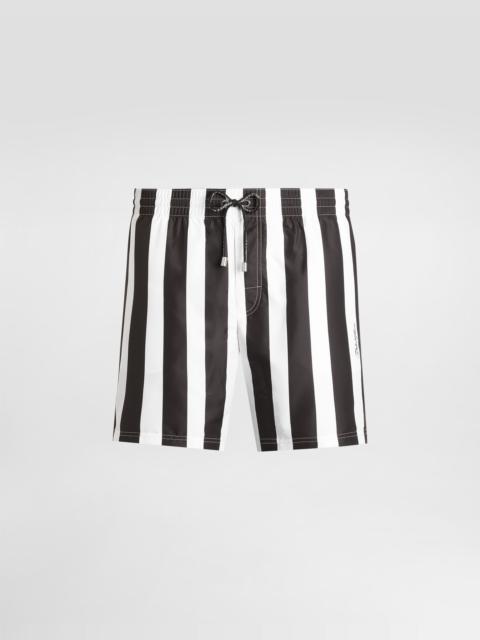 Mid-length swim trunks with striped print