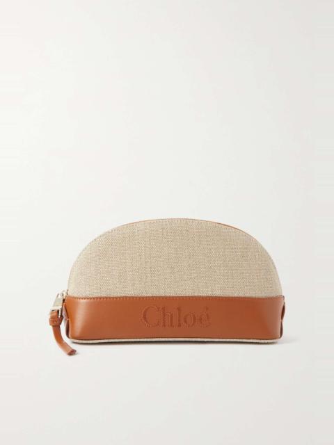 Leather-trimmed linen clutch