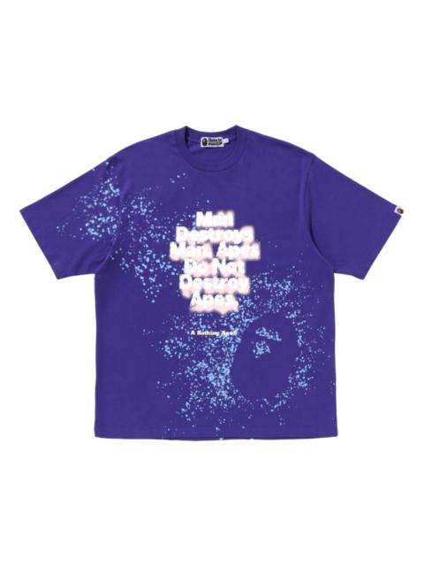 A BATHING APE® A Bathing Ape Spray Print Slogan Relaxed Fit T-Shirt 'Purple' 1K80-109-313-PUR