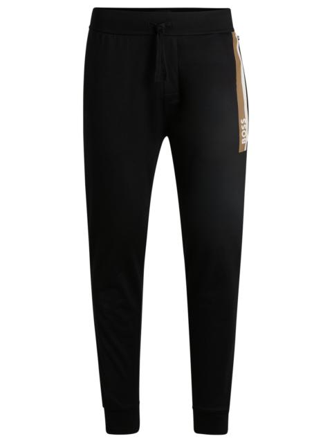 BOSS COTTON-TERRY TRACKSUIT BOTTOMS WITH STRIPE PRINT