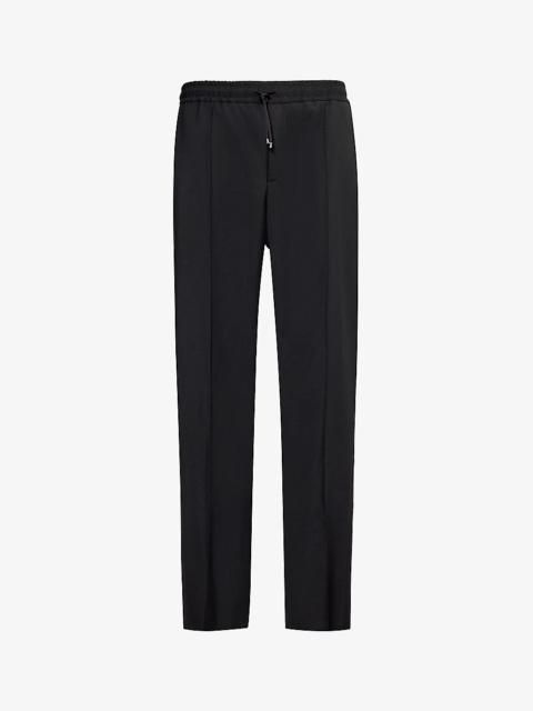 Brand-appliqué tapered-leg wool-blend trousers