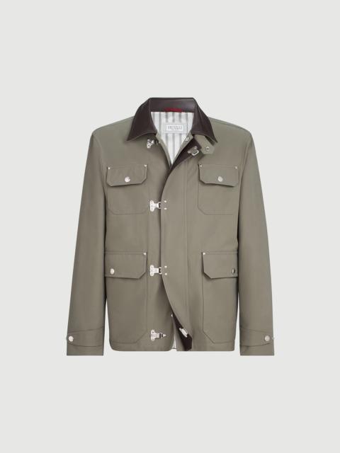 Water-resistant techno cotton gabardine outerwear jacket with leather inserts and hook fastening