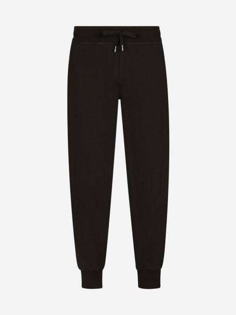 Jersey jogging pants with branded plate