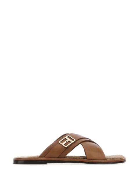 Brown leather slippers
