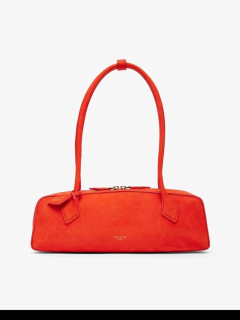 Alaïa Le Teckel Medium orange suede bag