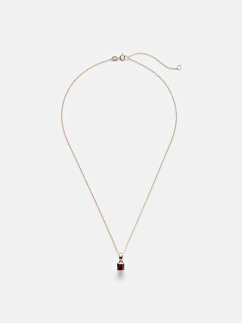 STONE AND STRAND 10kt gold charm necklace with garnet