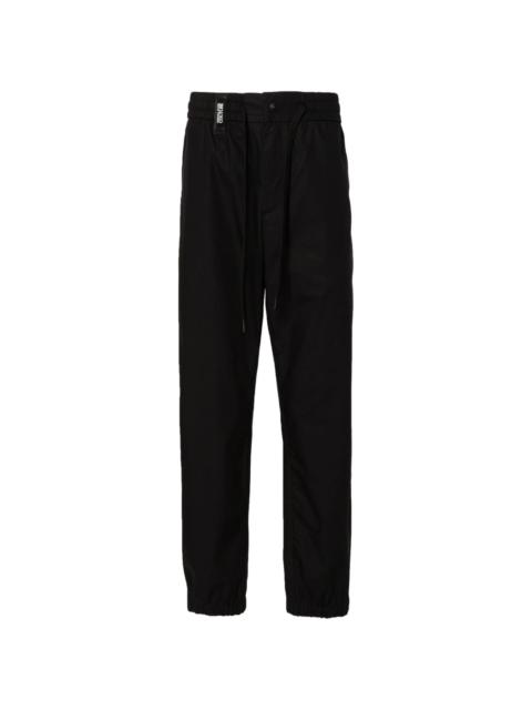 VERSACE JEANS COUTURE logo-strap tapered-leg trousers