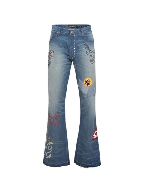 EARTHLING VIP graphic-patch button-fastening jeans