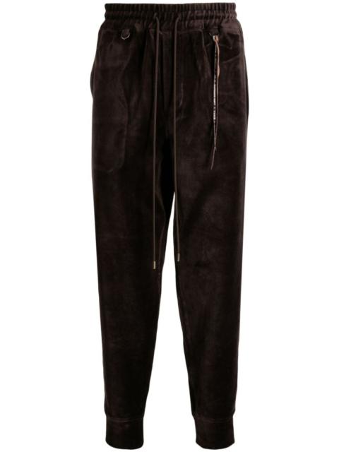 MASTERMIND WORLD tapered velour track pants