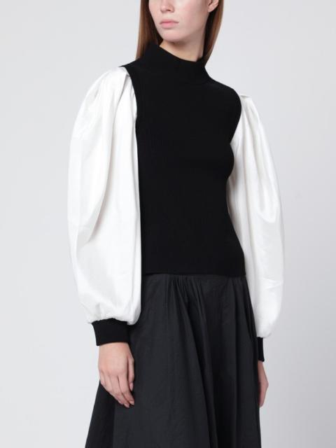 Black Jackie turtleneck with white sleeves