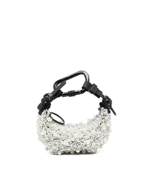 Innerraum pearl-embellished carabiner clutch bag