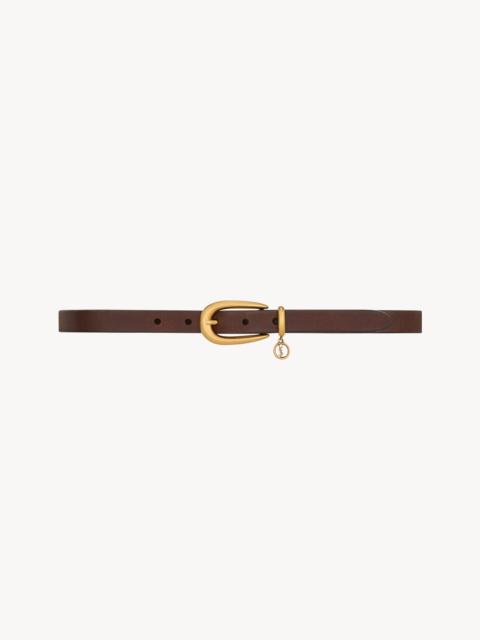 SAINT LAURENT CASSANDRE CHARM ELONGATED BUCKLE THIN BELT IN LEATHER
