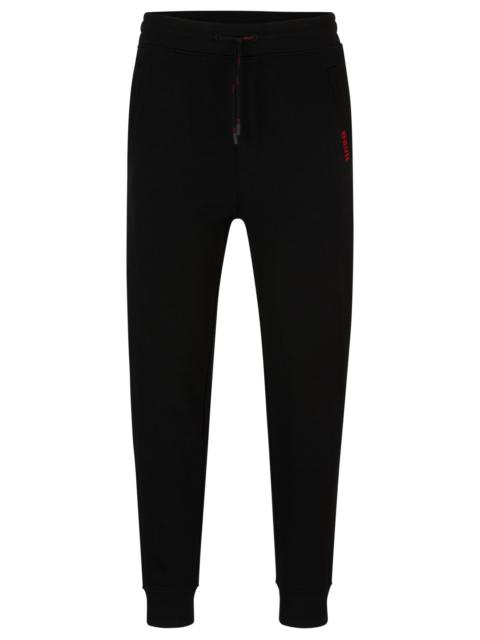 COTTON-TERRY TRACKSUIT BOTTOMS WITH LOGO DETAIL