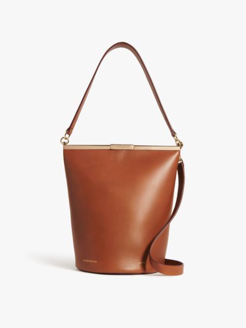 Victoria Beckham Frame Bucket Bag In Cognac Leather