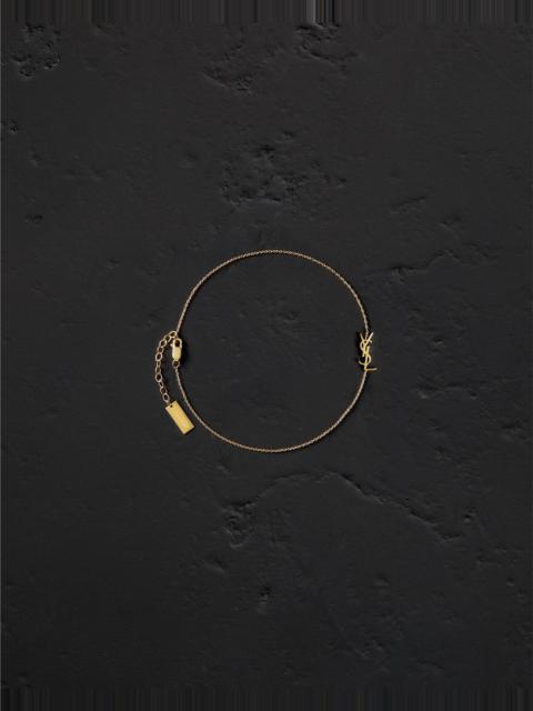 SAINT LAURENT CASSANDRE ANKLE BRACELET IN 18K YELLOW GOLD