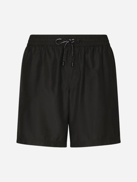 Mid-length swim shorts with top-stitching