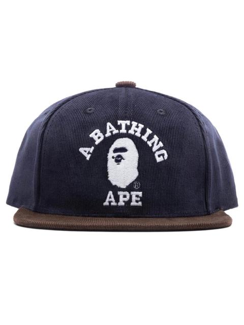 A BATHING APE® CORDUROY COLLEGE SNAP BACK CAP - NAVY