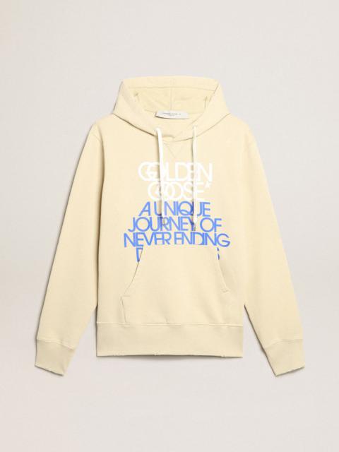 Marzipan-colored sweatshirt with lettering on the front