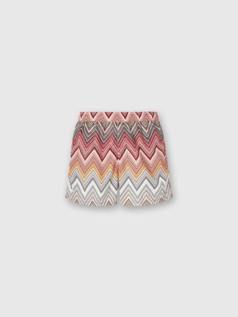 Swimming trunks with large zigzag print
