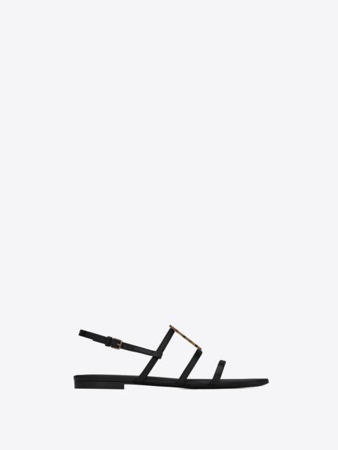 SAINT LAURENT cassandra flat sandals in smooth leather with gold-tone monogram