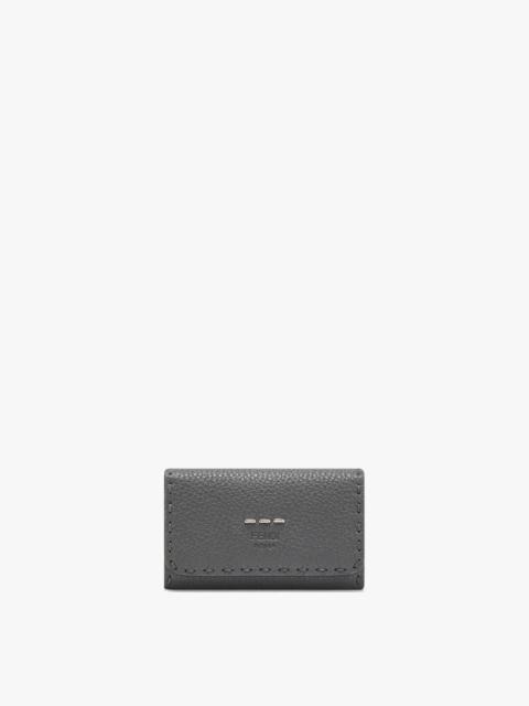 FENDI Tri-fold pouch with internal key ring. Press-stud fastening. Made of gray Roman leather. Branded wit
