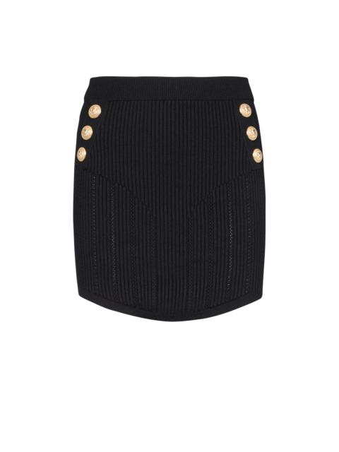 Short eco-designed knit skirt with double-buttoned fastening