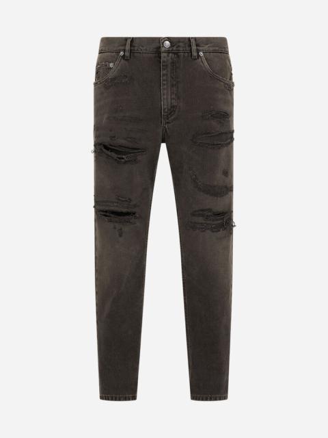 Loose light gray jeans with repaired rips