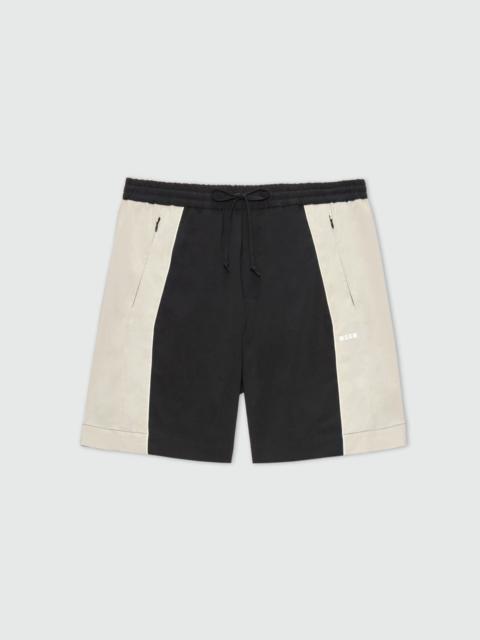 MSGM Black stretch cotton Bermuda shorts with color-block inserts.