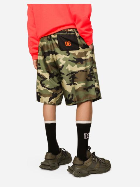 Dolce & Gabbana Silk shorts with camouflage print and patch