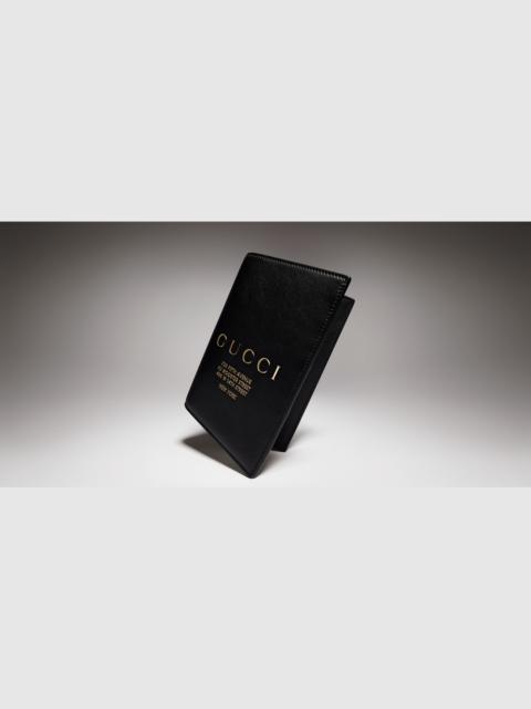 GUCCI Passport case with gold-foiled logo