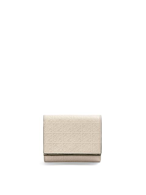 Repeat trifold wallet in embossed calfskin