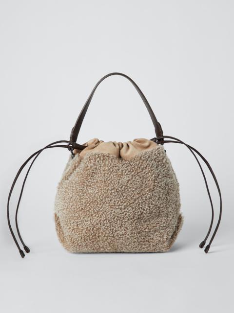 Curly shearling and suede bucket bag with monili