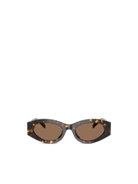 TORY BURCH pierced oval sunglasses