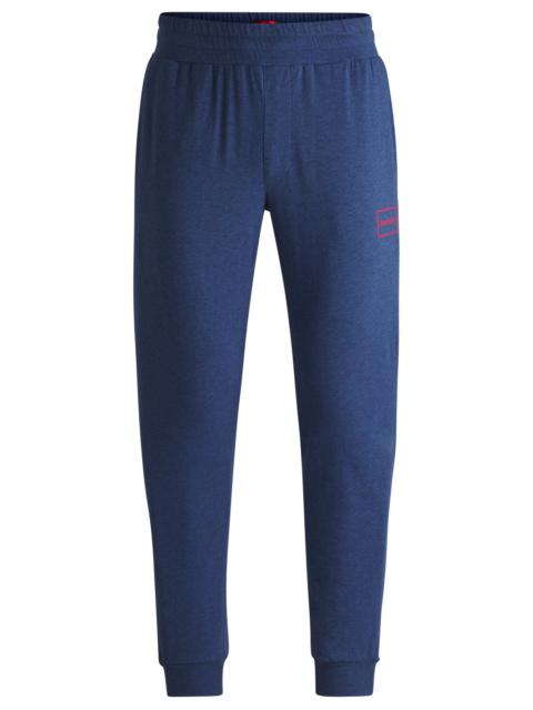 HUGO STRETCH-COTTON TRACKSUIT BOTTOMS WITH LOGO PRINT