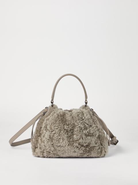 Brunello Cucinelli Mellow small bucket bag in fuzzy shearling with precious chain