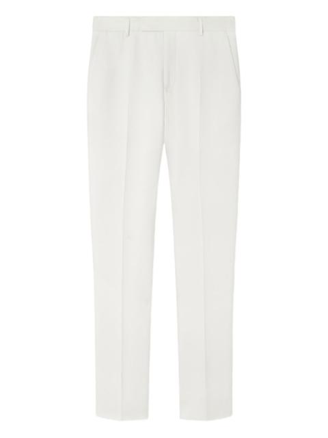 VERSACE logo-patch trousers
