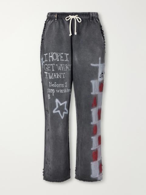 SATOSHI NAKAMOTO Get What I Want Distressed Embellished Printed Sweatpants