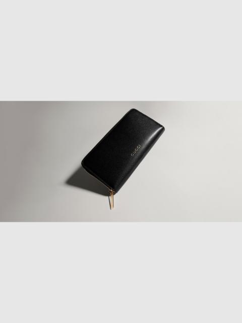 GUCCI Zip around wallet with Gucci lettering