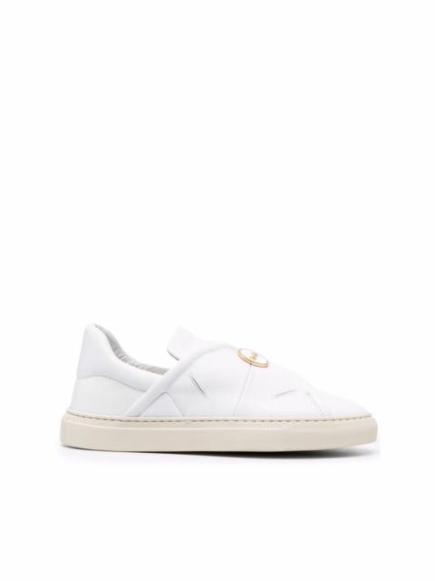 button-embossed slip-on sneakers