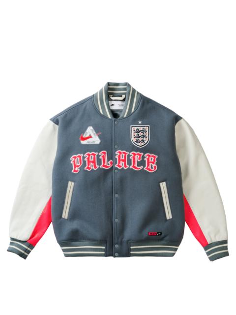 PALACE PALACE NIKE ENGLAND VARSITY JACKET COOL GREY / WHITE / BRIGHT CRIMSON