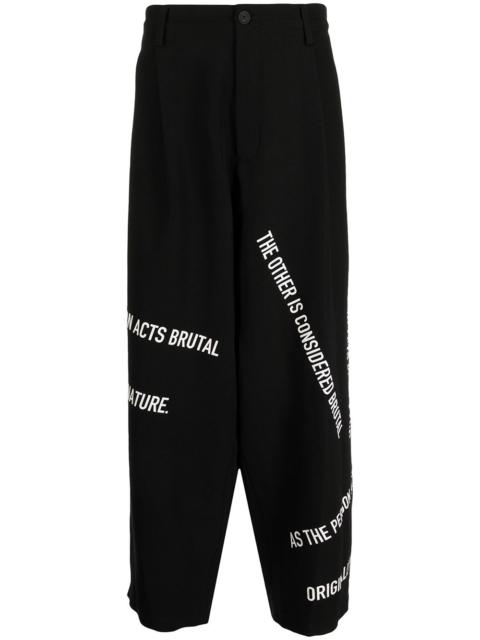 Yohji Yamamoto slogan-print straight-leg trousers