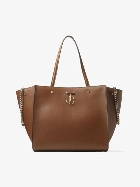 JIMMY CHOO Varenne Tote Bag
Dark Tan Fine Shiny Calf Leather Tote Bag with Light Gold JC Emblem